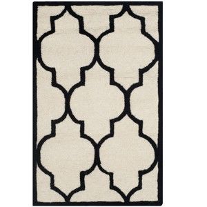 Biało-czarny dywan wełniany Everly 121x182 cm